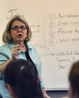 A college professor teaching in a university classroom full of students in Tennessee, United States 01